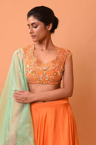 Bright Orange Lehenga With Intricate Handwork 