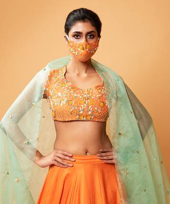 Bright Orange Lehenga With Intricate Handwork  6