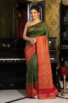 Green woven silk blend saree with blouse