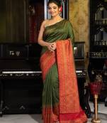 Green woven silk blend saree with blouse