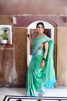 Green woven Faux kanchipuram silk saree with blouse