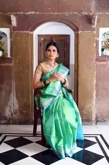 Green woven Faux kanchipuram silk saree with blouse
