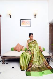 Green woven Faux kanchipuram silk saree with blouse