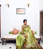 Green woven Faux kanchipuram silk saree with blouse