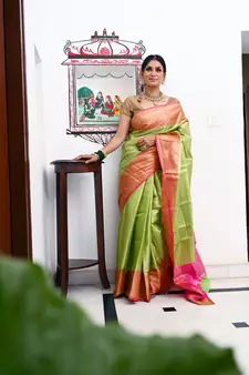 Green woven Faux kanchipuram silk saree with blouse