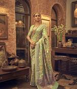 Green woven silk saree with blouse