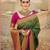 Dark green woven silk saree with blouse