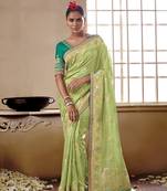 Green woven silk saree with blouse