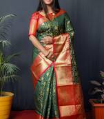 Green woven kanchipuram silk blend saree with blouse