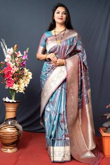 Dark green woven Banarasi silk blend saree with blouse