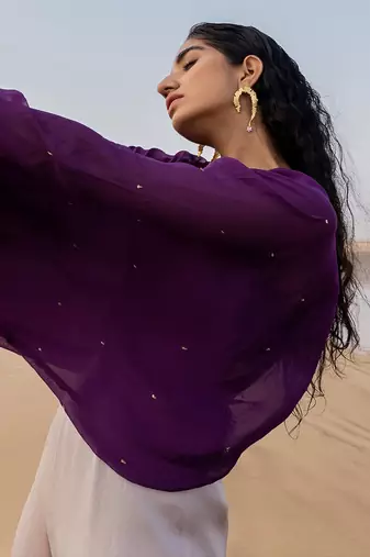 PURPLE CHITTA  IVORY JUMPSUIT WITH PURPLE BRALETTE AND A STATEMENT BELT
