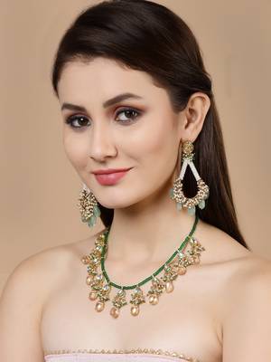 Yellow kundan, pearls, natural stones, faux emerald necklaces 1