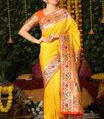 Dark green woven raw silk saree with blouse