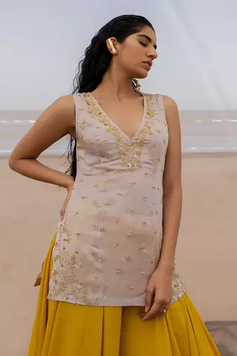 Ivory V Neck Jaal Organza Kurti With Ivory Bralette And Mustard Kalidar Palazzo With Corner Embroidered Butti Dupatta