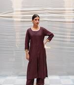 Brown cotton silk straight kurta with hand embroidered sequin zardozi border on sleeves .The kurta is paired with pants.