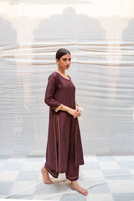 Brown cotton silk straight kurta with hand embroidered sequin zardozi border on sleeves .The kurta is paired with pants. 3
