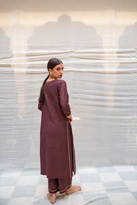Brown cotton silk straight kurta with hand embroidered sequin zardozi border on sleeves .The kurta is paired with pants. 4
