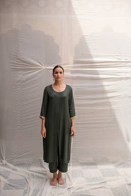 Green cotton straight kurta with herringbone weave  highlighted with hand embroidered sequin zardozi border on sleeves. 1