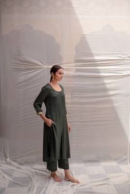 Green cotton straight kurta with herringbone weave  highlighted with hand embroidered sequin zardozi border on sleeves. 2