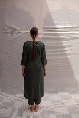 Green cotton straight kurta with herringbone weave  highlighted with hand embroidered sequin zardozi border on sleeves. 3