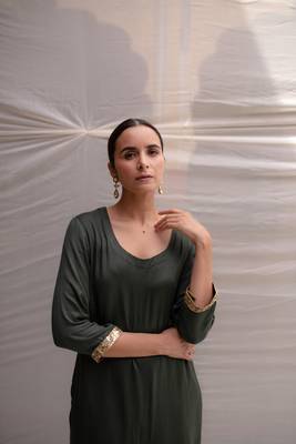Green cotton straight kurta with herringbone weave  highlighted with hand embroidered sequin zardozi border on sleeves. 4