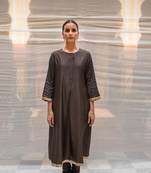 Black silk lucknawi style kurta with kalis highlighted with hand embroidered sequin zardozi border on sleeves and hem.