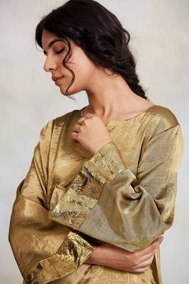 Gold silk tissue flowy kurta with gota and asymetrical hemline paired with kalidaar pajama 4