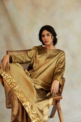 Gold silk tissue flowy kurta with gota and asymetrical hemline paired with kalidaar pajama 5
