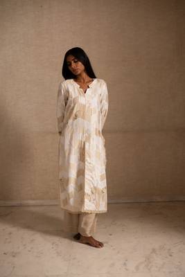 Upcycled patchwork kurta in shades of ivory and beige made with remnants of heritage fabrics like silks,cottons,prints. 1