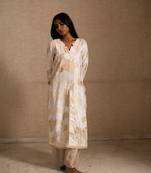Upcycled patchwork kurta in shades of ivory and beige made with remnants of heritage fabrics like silks,cottons,prints.