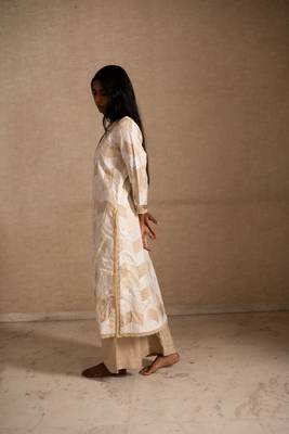 Upcycled patchwork kurta in shades of ivory and beige made with remnants of heritage fabrics like silks,cottons,prints. 2