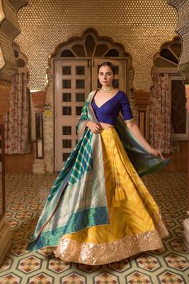 Upcycled patchwork lehenga in shades of yellow made with remnants of heritage fabrics like silks, cottons, prints. 1