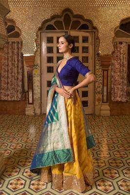 Upcycled patchwork lehenga in shades of yellow made with remnants of heritage fabrics like silks, cottons, prints. 2