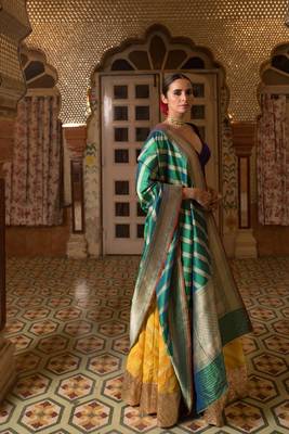 Upcycled patchwork lehenga in shades of yellow made with remnants of heritage fabrics like silks, cottons, prints. 3