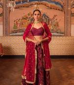 Upcycled patchwork lehenga in shades of burgundy  made with remnants of heritage fabrics like silks, cottons, prints.