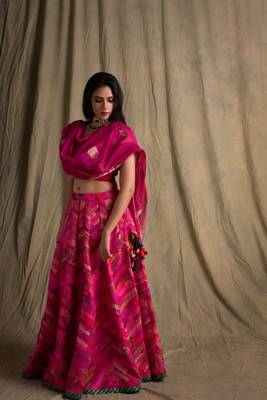 Upcycled patchwork lehanga in shades of pink with hand made gota border paired with pink silk blouse and chanderi. 1