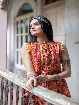 Eye catchy organge embroidered peplum style top with colorfull flairy skirt 2