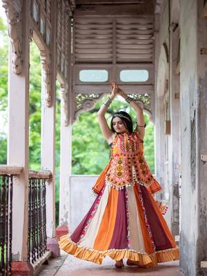 Eye catchy organge embroidered peplum style top with colorfull flairy skirt 4