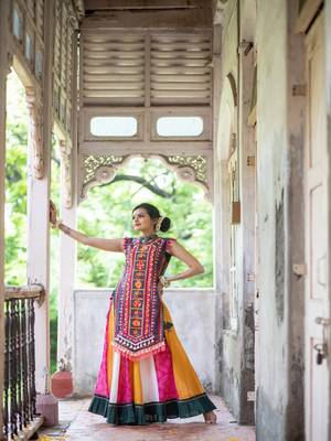 Deep green elephant motif treditional embroidered panel top with colorfull flairy skirt 1