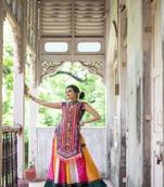 Deep green elephant motif treditional embroidered panel top with colorfull flairy skirt