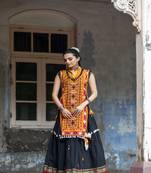 Mustured yellow treditional embroidered panel top with black daman flairy skirt