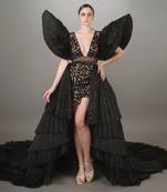 Black Embroidered Mini Dress With Pleated Power Shoulder And A Detachable Layered Pleated Trail