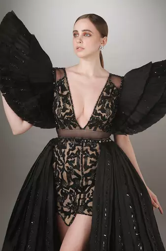 Black Embroidered Mini Dress With Pleated Power Shoulder And A Detachable Layered Pleated Trail