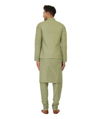 Nehru jacket in cotton silk base. It is paired with a matching kurta and a churidar pyjama. 2