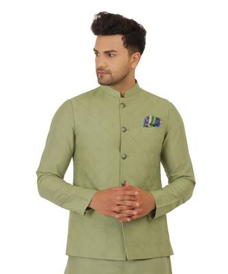 Nehru jacket in cotton silk base. It is paired with a matching kurta and a churidar pyjama. 3