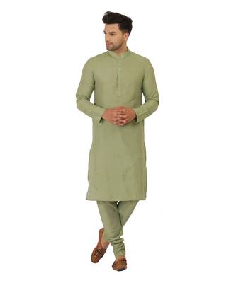 Nehru jacket in cotton silk base. It is paired with a matching kurta and a churidar pyjama. 4