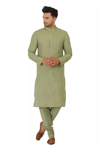 Nehru jacket in cotton silk base. It is paired with a matching kurta and a churidar pyjama.