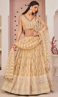Beige embroidered net semi stitched lehenga 1