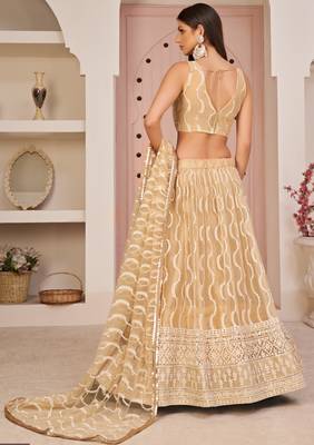 Beige embroidered net semi stitched lehenga 4