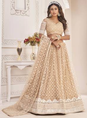 Beige embroidered net semi stitched lehenga 1